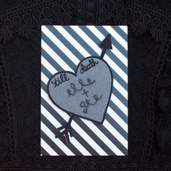 'till death heart patch with custom chain stitching.