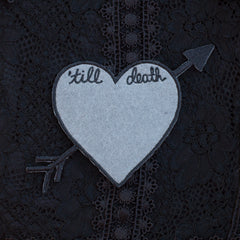 'till death heart patch with custom chain stitching.