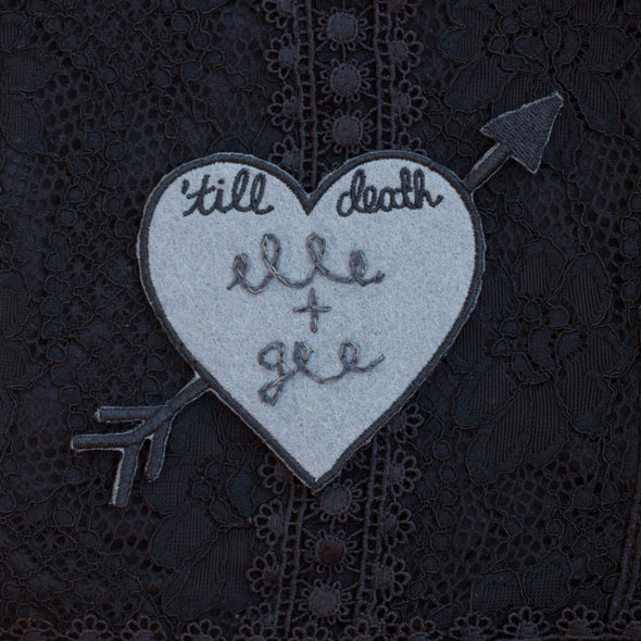 'till death heart patch with custom chain stitching.